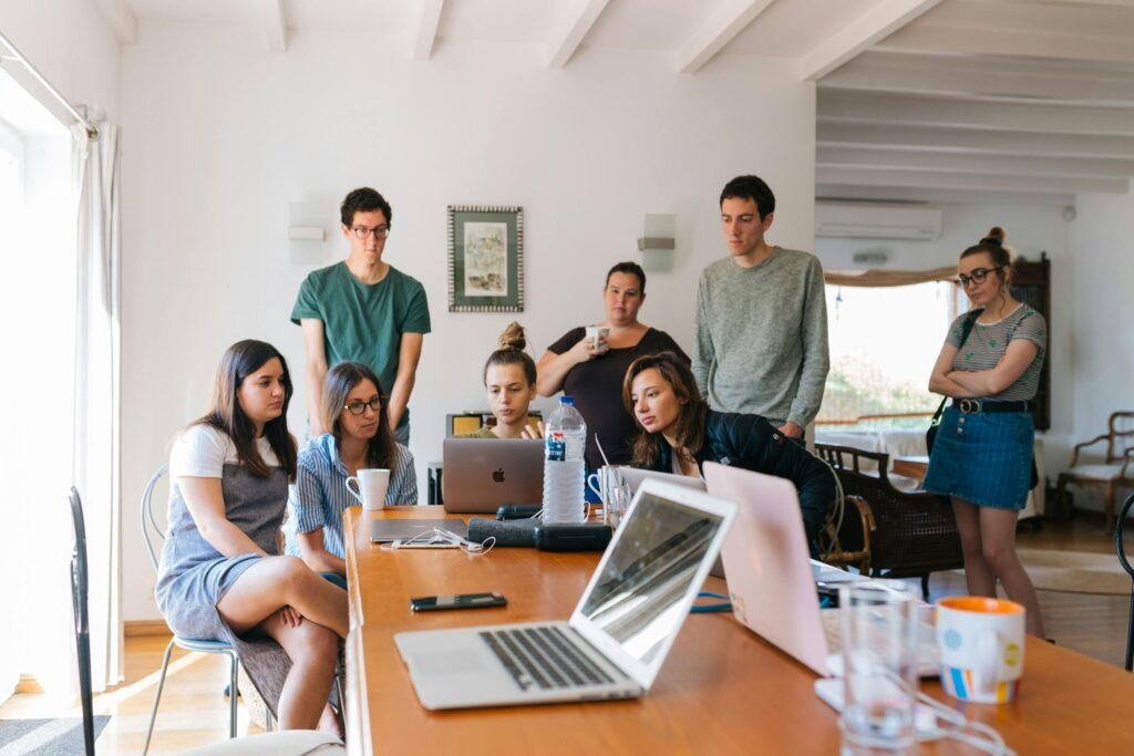 pexels photo 1595385 1595385 Group of young professionals engaged in a collaborative meeting in a modern office setting.